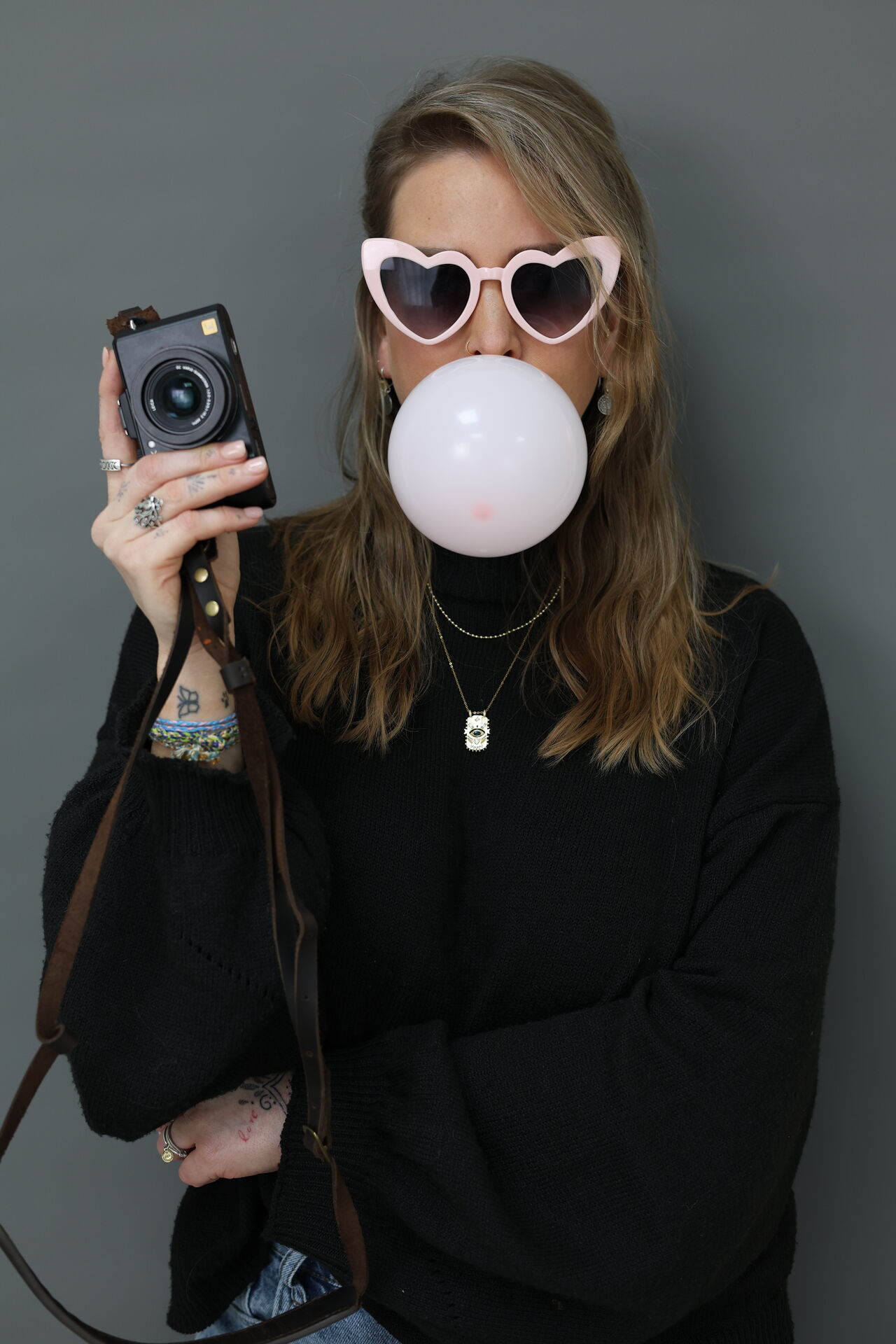 Woman using a gua sha facial tool, beauty brand photography