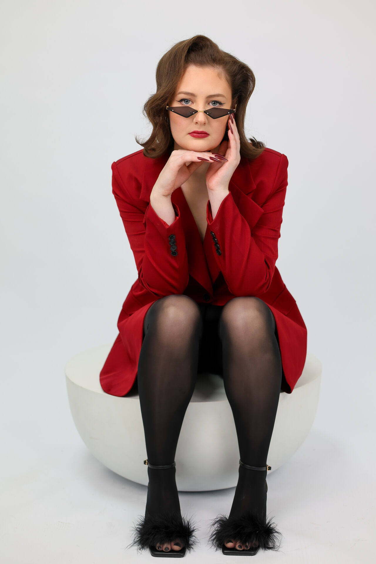 Woman in red blazer and sunglasses, editorial brand photography